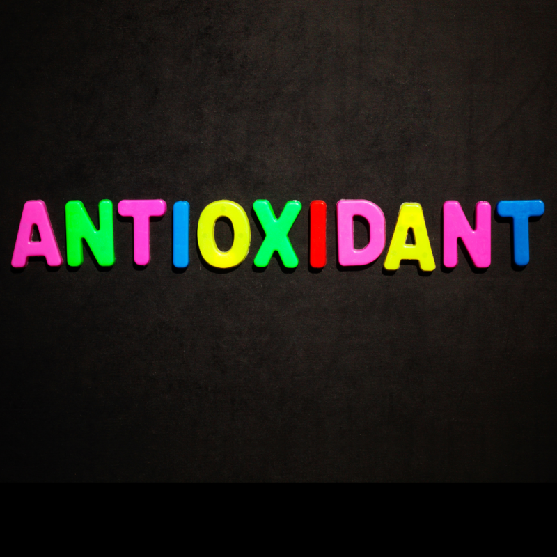 a black background with antioxidant written on it in colorful alphabets